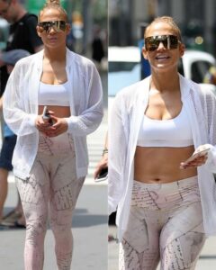 Jennifer Lopez shows off her plump belly. She also proudly shows off her fit legs and signature butt..
